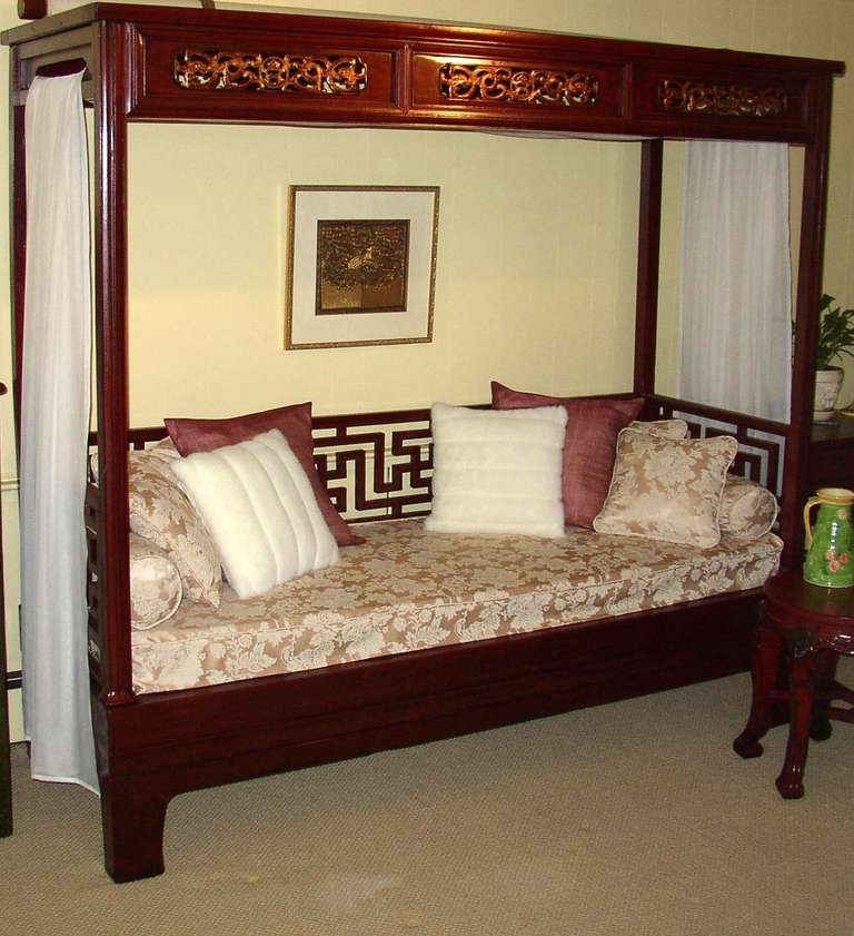 Elegant red Lacquer Canopy Bed, 19th century, with intricate pierce carving on the top frame and geometric railing on the sides and back.
Note: Mattress is included. The pillows, bed sheet and frame artwork are not included.