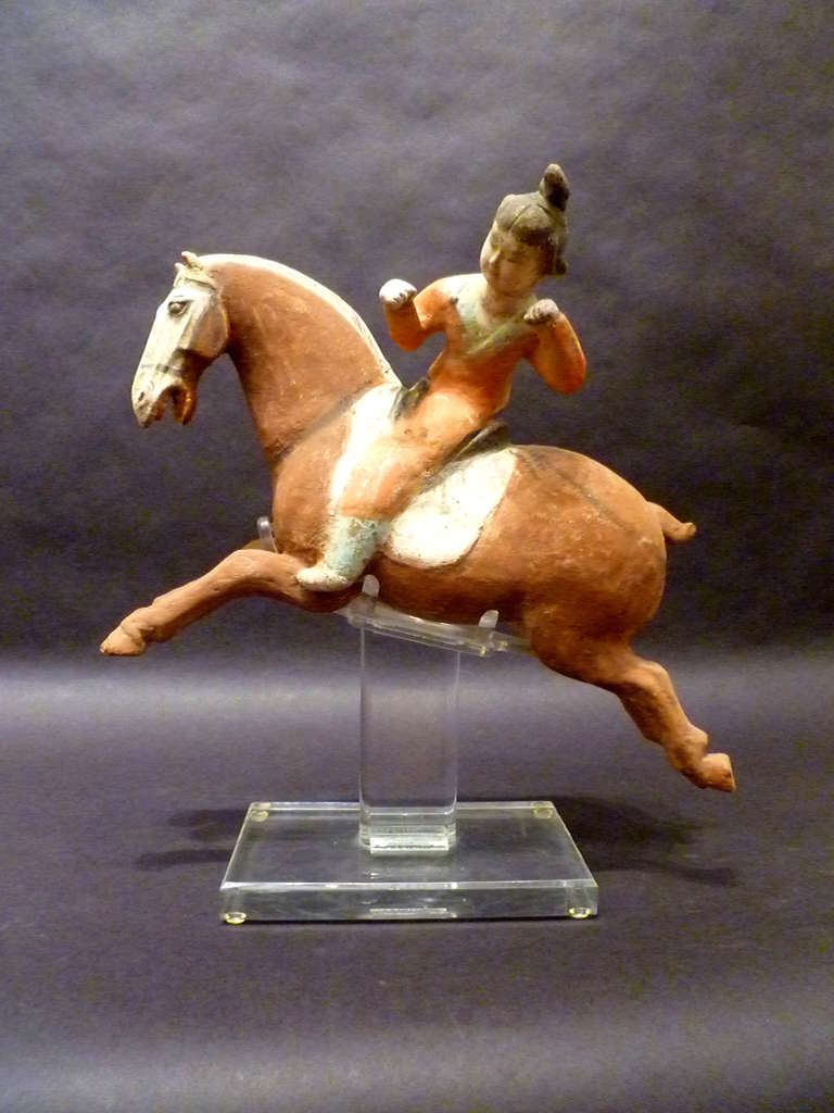 Chinese A Superb and Playful Tang Dynasty Pottery Statue of Lady Polo Player