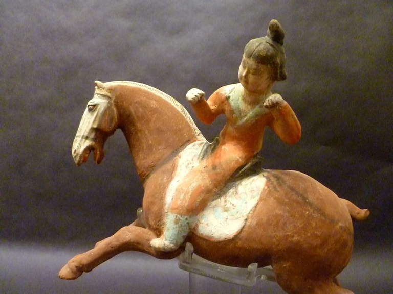 18th Century and Earlier A Superb and Playful Tang Dynasty Pottery Statue of Lady Polo Player