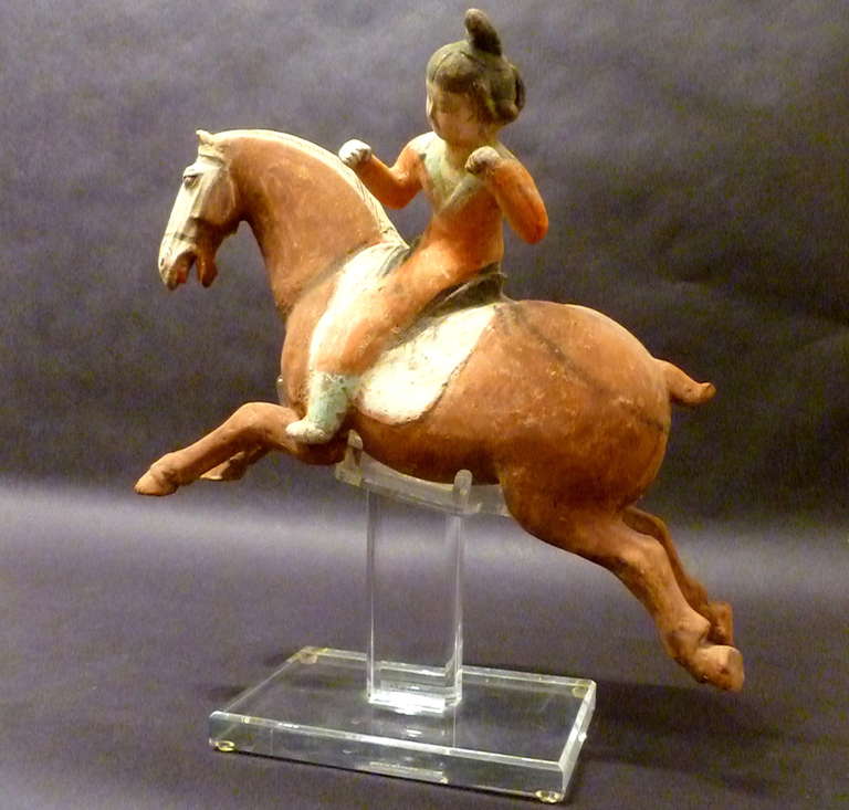 Terracotta A Superb and Playful Tang Dynasty Pottery Statue of Lady Polo Player