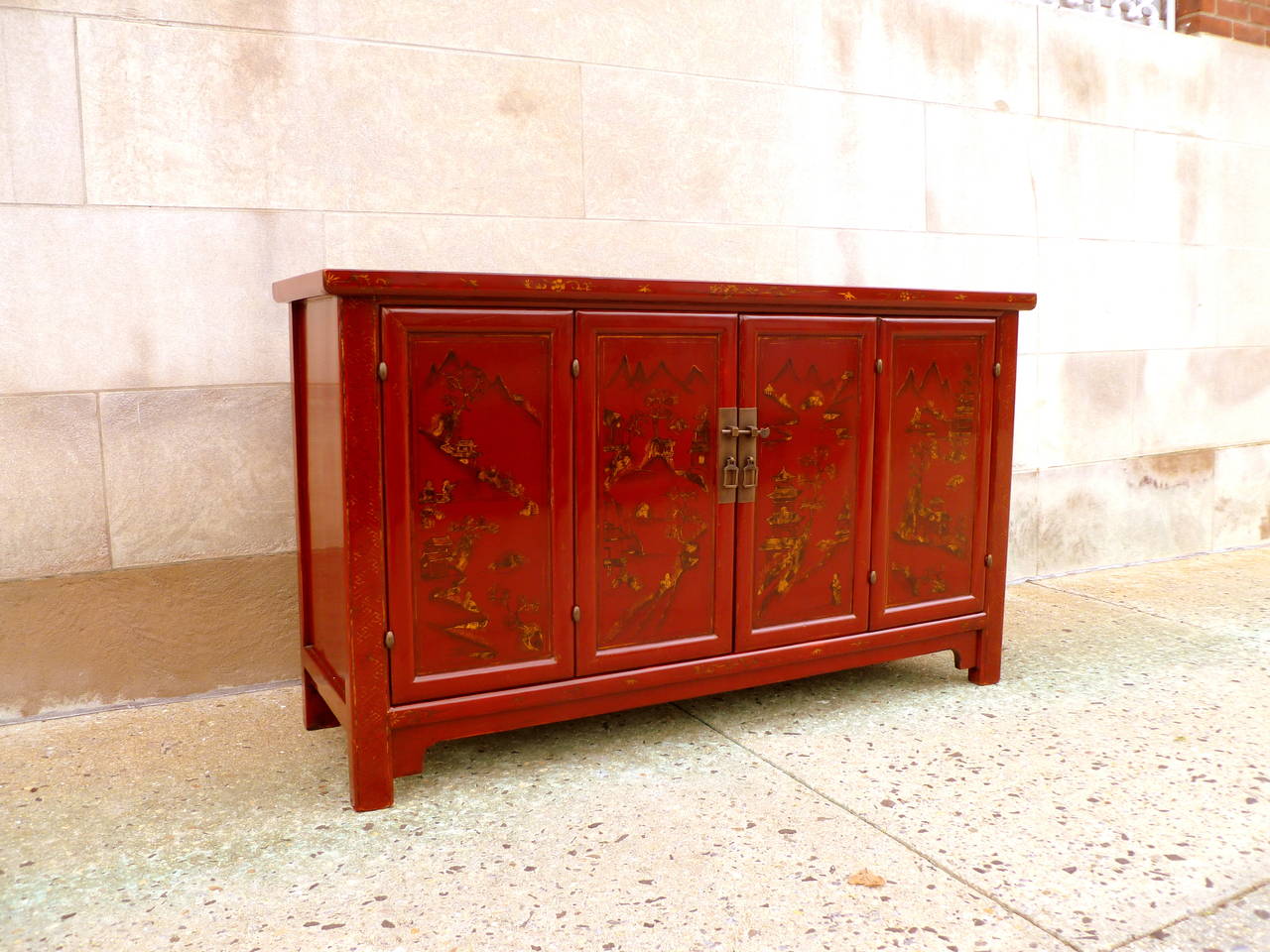 Early 20th Century Elegant Red Lacquer Sideboard with Gold Gilt Landscape Motif