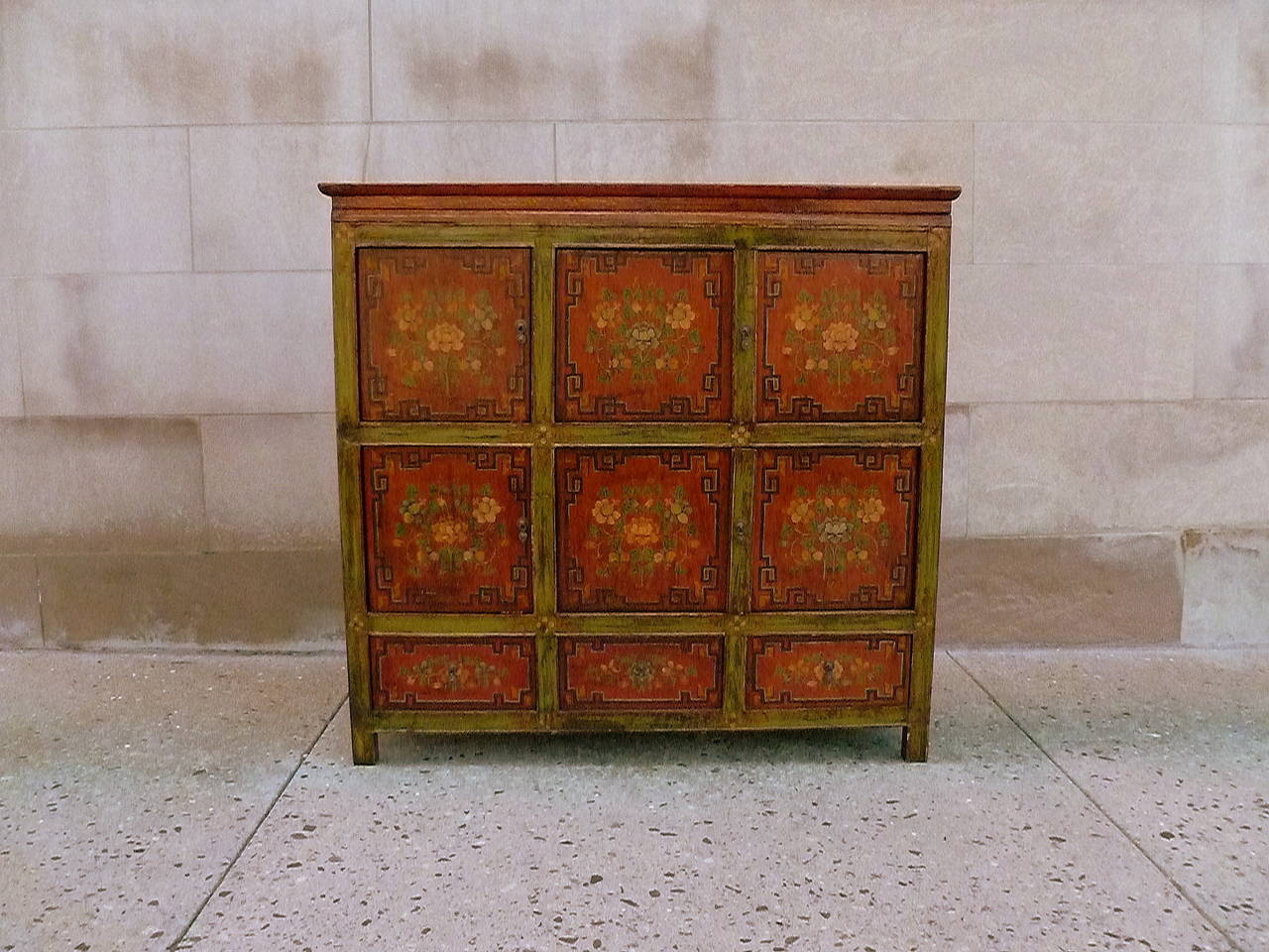 A beautiful Tibetan chest with hand-painted floral motif, two pairs of doors, simple form, elegant colors, 19th century.