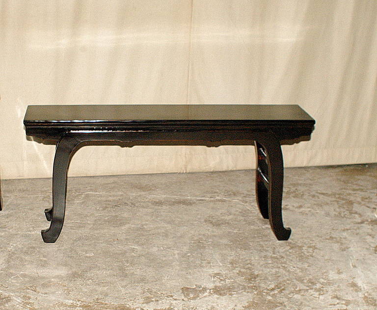Fine black lacquer bench, single plank top supported by S-shaped legs and joined by stretchers. Beautiful color and form.