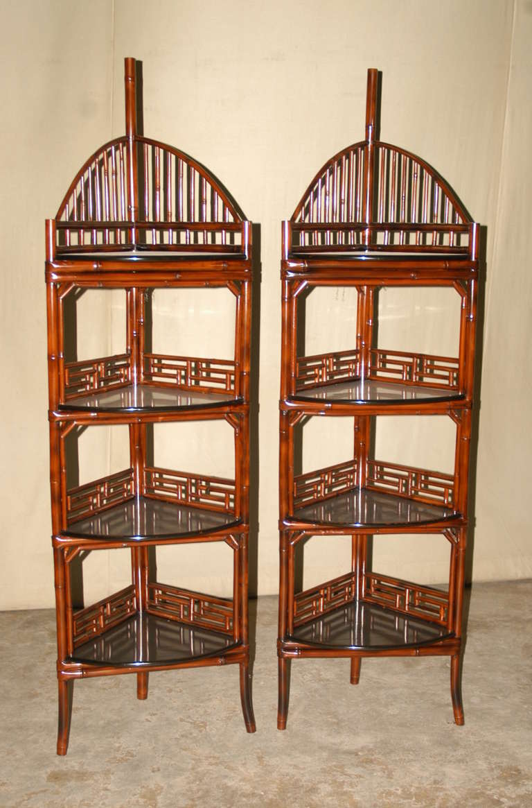 A refined and elegant bamboo corner stand, four black lacquer shelves with rounded front, lattice fret work railing. Selling pair or single, $2600 each. Beautiful style, elegant detail.  We carry fine quality furniture with elegant finished and has