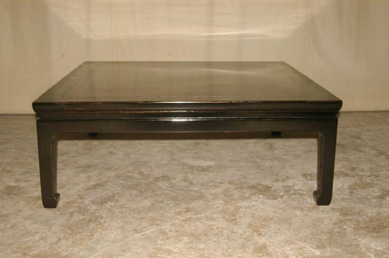 Simple and elegant square black lacquer low table with straight legs. Beautiful color and form.