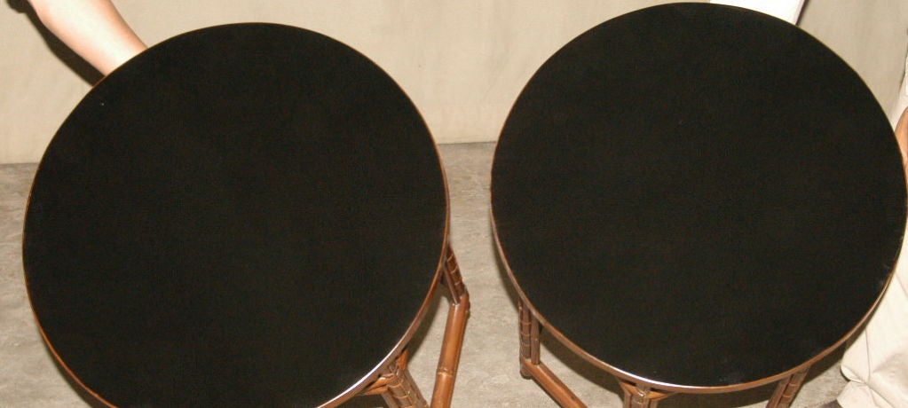 Ming A Pair Of Round Bamboo End Tables With Black Lacquer Tops