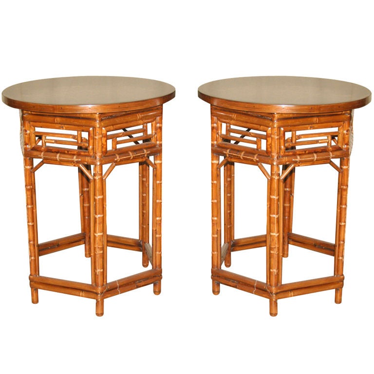 A Pair Of Round Bamboo End Tables With Black Lacquer Tops