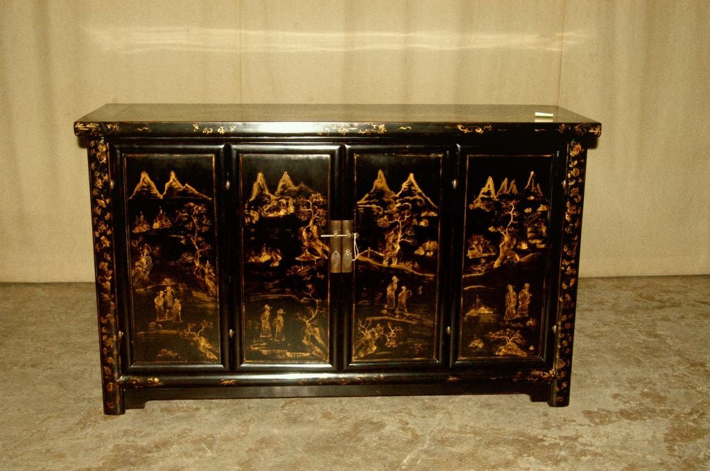 a very beautiful black lacquer sideboard, fine painted gold gilt motif on the pair of bi-fold doors, brass fitting. View our website at: www.greenwichorientalantiques.com for additional sideboard selections.