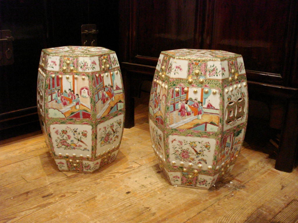 a pair of very elegant and refined hexagonal porcelain stools, fine hand painted polychrome and gold gilt motif, auspicious coin motif on the top and sides, beautiful color, form and lines. View our website at: www.greenwichorientalantiques.com for