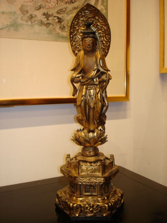 A fine Japanese gold giltwood Buddhisattva standing on lotus base. Beautiful color, form and lines.