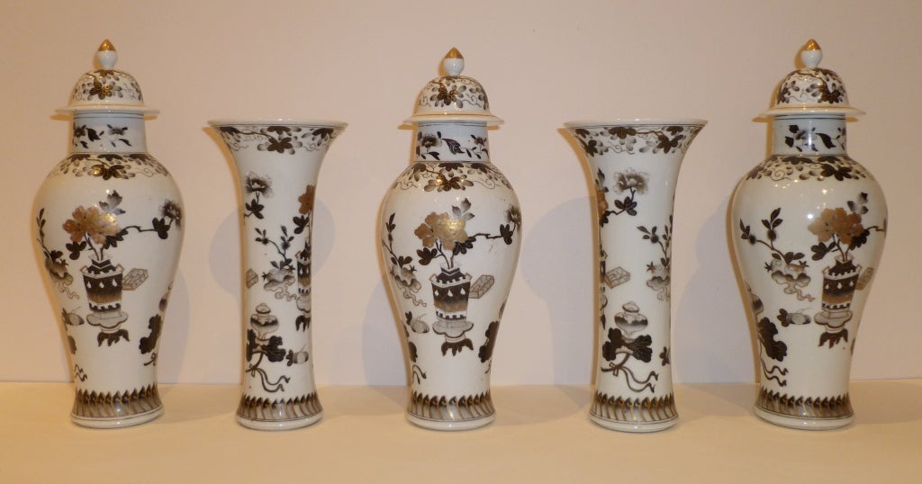 a set of five fine and elegant porcelain vases with hand painted floral motif and gold gilt detail, beautiful form and colors. Please view our website at www.greenwichorientalantiques.com for additional porcelain vase selections in works of art