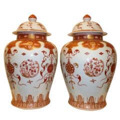 A Pair Of Porcelain Cover Jars With Polychrome Motif