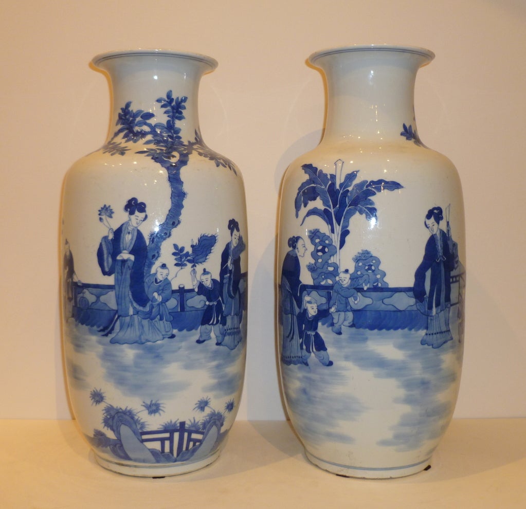 A pair of refined and elegant porcelain vases with hand painted blue and white garden motif, beautiful form and colors.