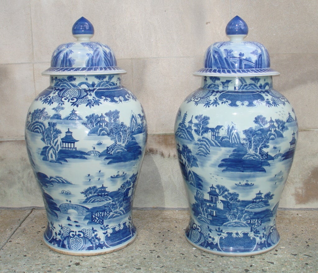A Pair Of Large Porcelain Cover Jars With Blue And White Motif