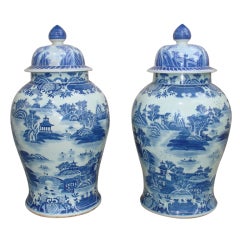A Pair Of Large Porcelain Cover Jars With Blue And White Motif