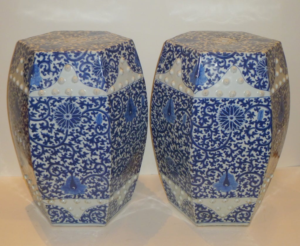 a pair of fine hexagonal porcelain stools with hand painted blue and white floral motif, beautiful colors, elegant form and lines. Please view our website at www.greenwichorientalantiques.com for additional porcelain stools selection in furniture