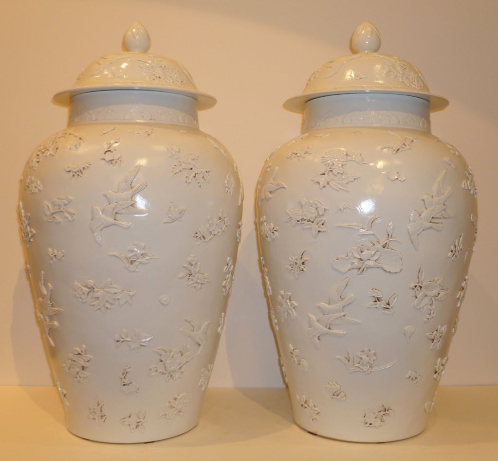A Pair of Fine and Elegant Blanc De Chin White Porcelain Cover Jars with birds and flowers motif, beautiful form, lines and detail. 