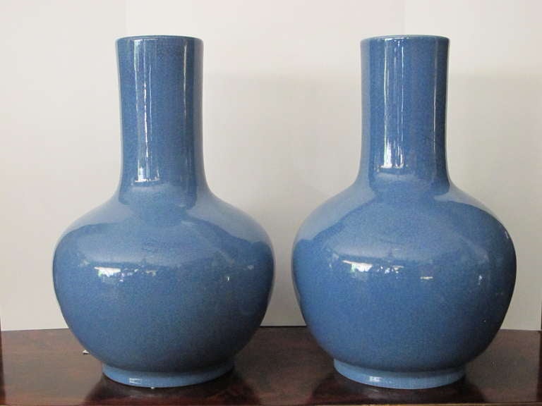 Pair of Chinese robin egg blue vases with a crackled glaze.