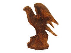 Cast iron eagle on rock