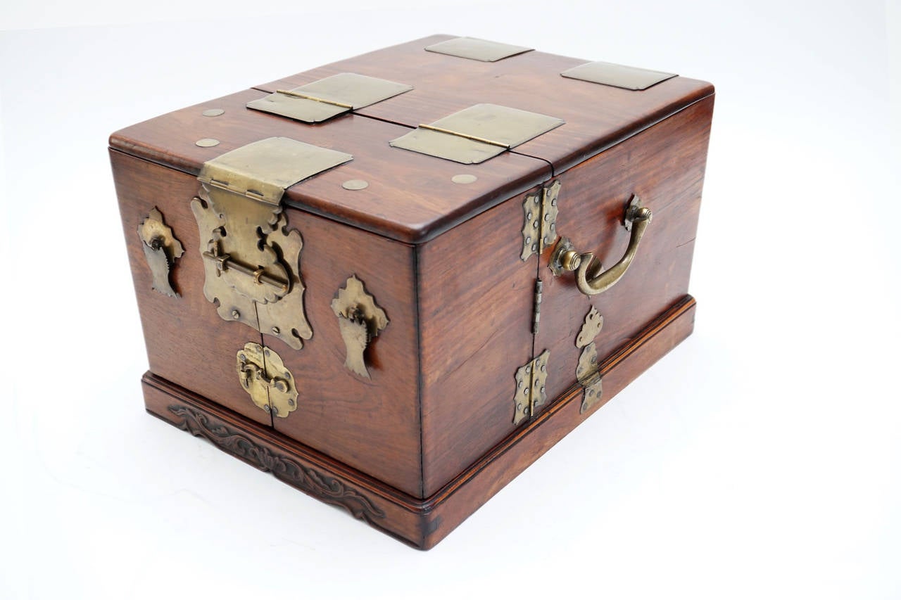 Ming Dynasty style dressing case made of rare huanghuali wood with brass mounts and mirror.