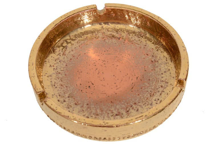 Raymor Bitossi Mid-Century Gold Tray Ashtray circa 1950's from Italy.Gold glazed ceramic form dish can be used as an ashtray, or a very stylish decorative object.Partial Raymor label intact.

This item is located at our 1stdibs booth in the New