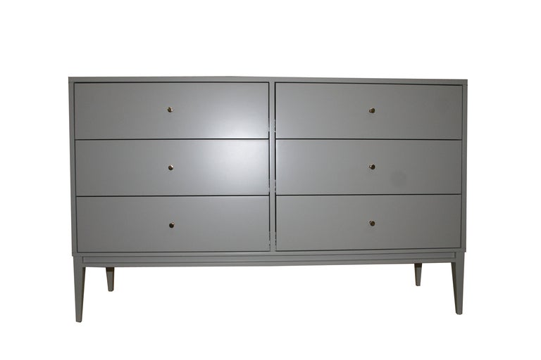 Six-drawer lacquered dresser on tapered legs. Solid brass pulls, grey satin lacquer finish, solid maple construction.

Custom orders have a lead time of 10-12 weeks FOB NYC. Lead time contingent upon selection of finishes, approval of shop