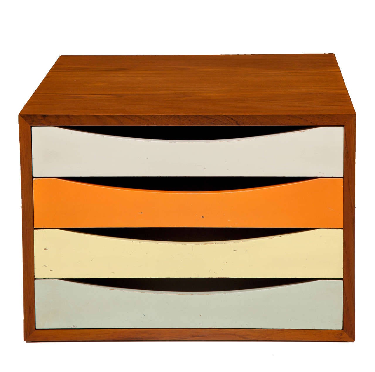 Rare to market Finn Juhl four-drawer teak desk console, circa 1950s. Teak exterior carcass houses a bank of multicolored lacquered drawers. Designed in 1953. Produced by Bovirke.