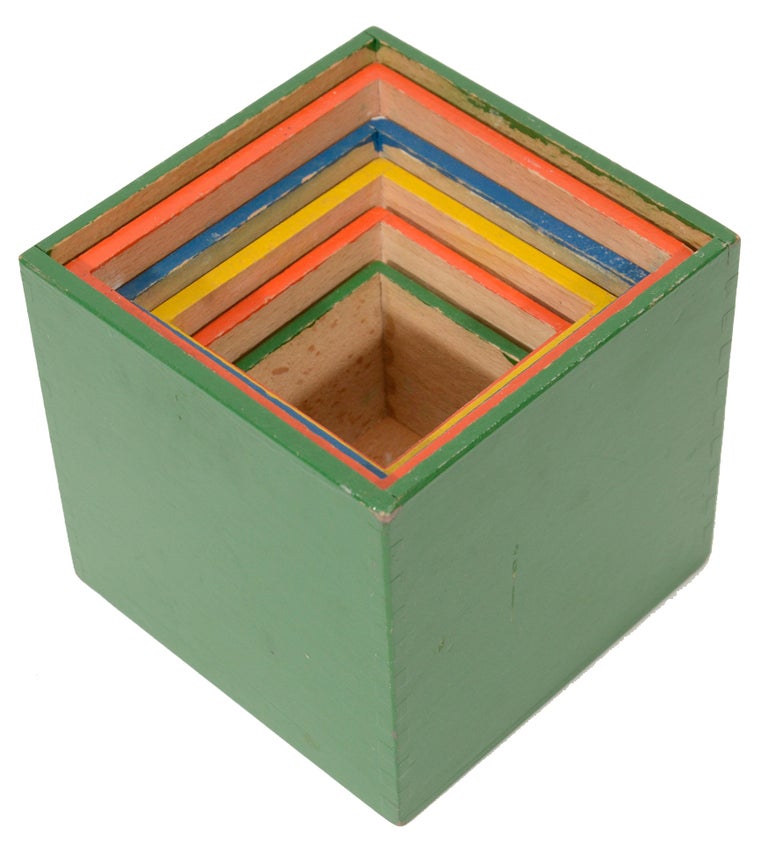 Mid-Century nesting toy stacking boxes from Germany Circa 1960.Solid beach boxes with painted exterior are nicely constructed with finger joint corner construction.Boxes all fit inside each other to rest in the larger green box.