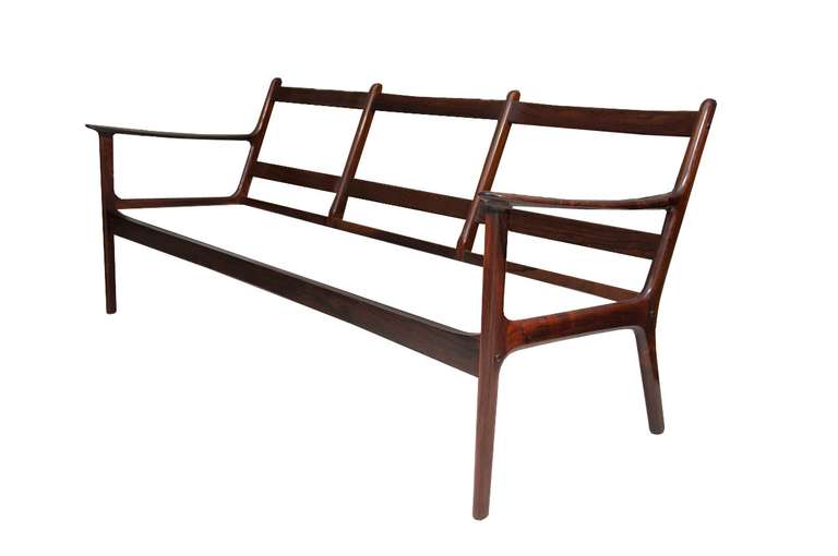 Ole Wanscher Danish modern rosewood sofa and chair set in all original condition with original loose wool cushions. Solid rosewood construction throughout, crafted in Denmark, circa 1960.