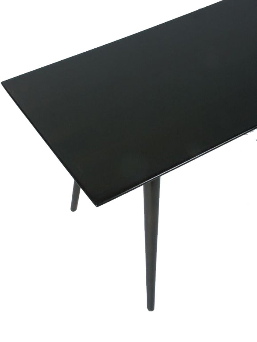 Paul McCobb black lacquered planner group coffee table.

Paul McCobb (1917-1969) is an American designer best known for the planner group, his collection of clean, utilitarian and well-priced modular residential furniture that was an instant