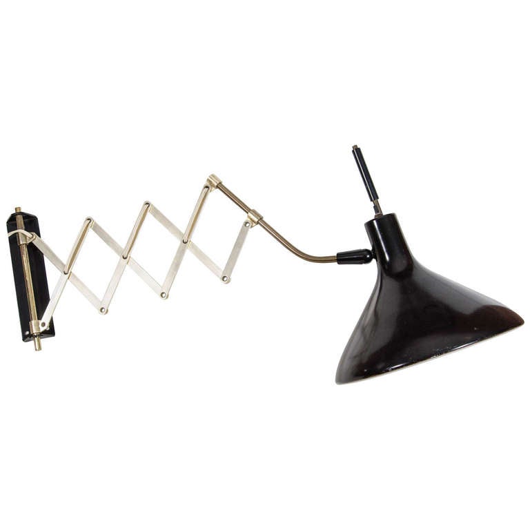 Gerald Thurston for Lightolier Adjustable Wall-mount Lamp circa 1950's.Wall mountable light fixture with retractable arm the pivots left and right with articulating 12