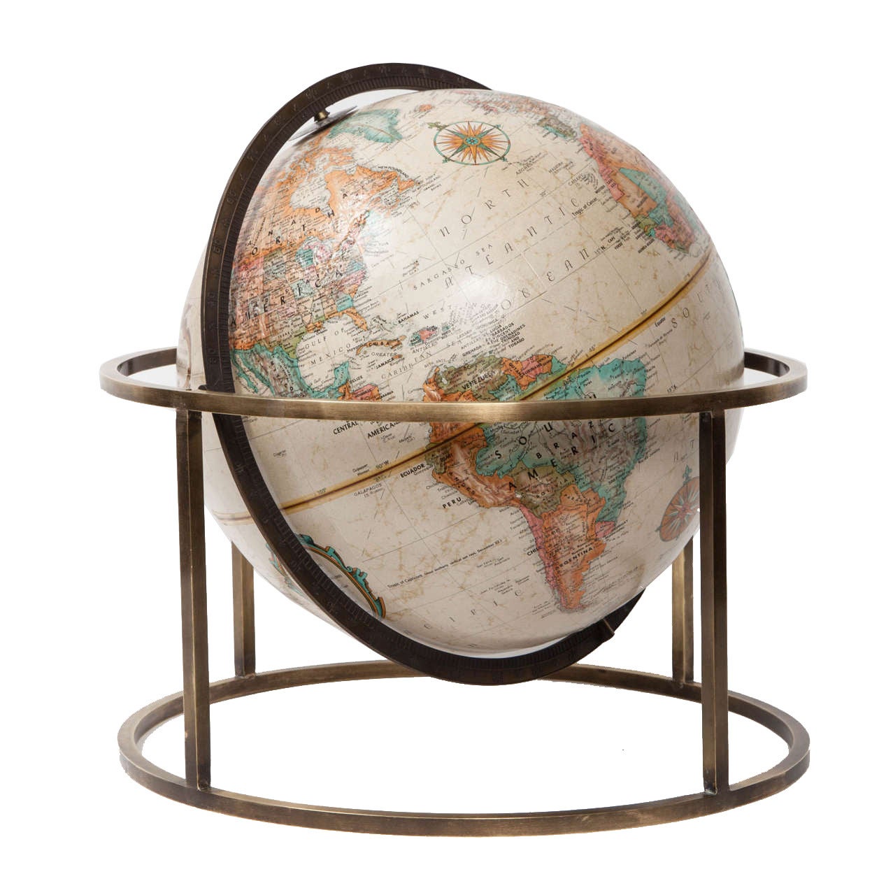 Paul McCobb style brass standing tabletop terrestrial globe, circa 1960. Gorgeous rotating globe with full 360 axis pivoting and spinning motion. Globe has raised textured exterior.