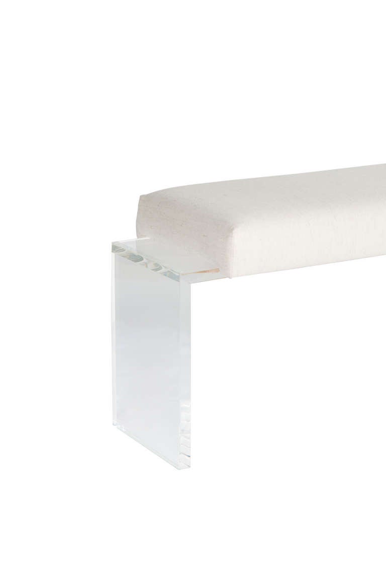 Lucite frame upholstered bench. One inch thick Lucite base supports upholstered top.

COM requirements: 2 yards.
5% up-charge for contrasting fabrics and or welting.
COL requirements:40 sq. feet.
5% percentage up-charge for all COL or exotic