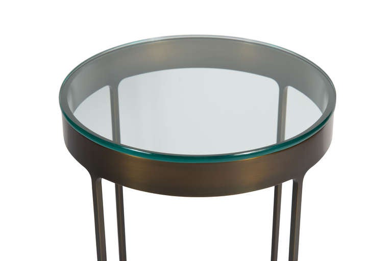 Bronze finish glass top side table constructed of half inch solid cold rolled steel. One piece clean construction with radiused corner joints where legs meet apron support half inch polished edge glass tops. Various Metal finishes and top material