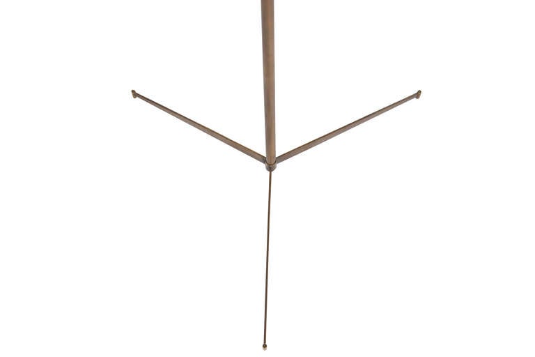 Solid brass tripod floor lamp shown in medium antiqued brass finish.
Base height 52”.

Custom orders have a lead time of 10-12 weeks FOB NYC. Lead time contingent upon selection of finishes, approval of shop drawings (if applicable), and receipt