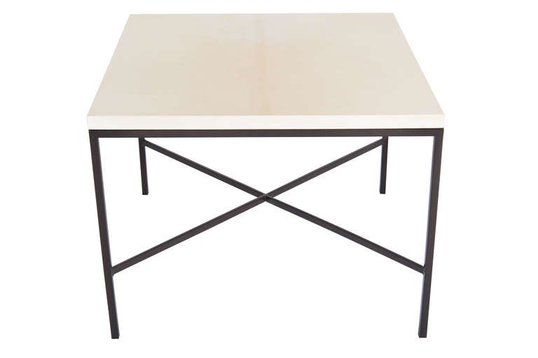 Blackened steel X stretcher Parchment top side table.Half in square stock metal frame with natural parchment wrapped top.

Custom orders have a lead time of 10-12 weeks FOB NYC. Lead time contingent upon selection of finishes, approval of shop