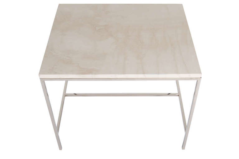 Nickel Frame H-base travertine top side table. Half Inch square stock table frame with polished nickel finish supports natural honed travertine top

Custom orders have a lead time of 10-12 weeks FOB NYC. Lead time contingent upon selection of