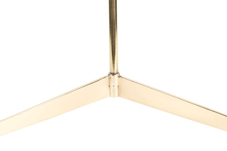 Solid brass tripod table lamp shown in polished brass finish.
Base height-25".

Custom orders have a lead time of 10-12 weeks FOB NYC. Lead time contingent upon selection of finishes, approval of shop drawings (if applicable) and receipt COM