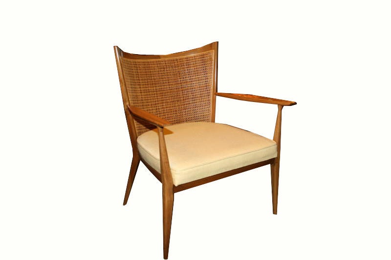 Paul McCobb for Directional solid Walnut caned back club chairs.Sculpted curve back profile with original inset natural caning contrasted by tight seating upholstery with sculpted arm detailing.Rare to market and in original condition these exhibit