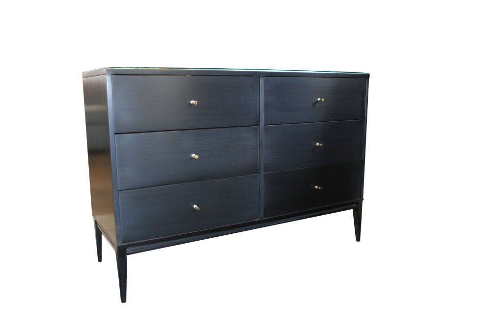 Paul McCobb 6 drawer Planner Group dresser Ca.1950s.Fully restored in a piano black lacquer finish with original polished solid brass drawer pulls.Constructed of solid maple throughout the dresser is very solid and in like new restored condition.<br