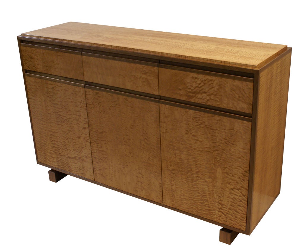 Mn Originals exotic veneer sideboard made to order. As shown, the piece highlights quilted maple veneer contrasted by solid walnut trim and base with fiddleback maple sides and top. Three drawers on top along with three doors all detailed with