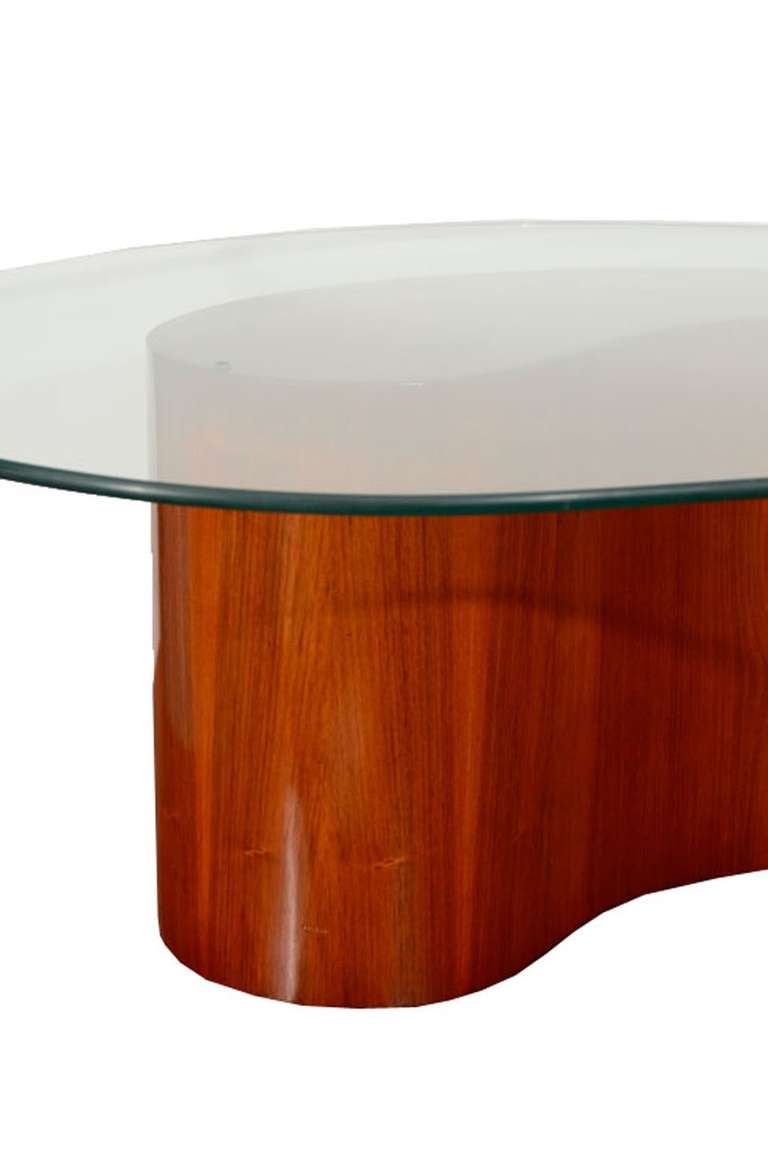 1960's Valadimir Kagan style comma shaped walnut base coffee table with original bio-morphic shaped glass top.Nicely restored with original glass top.
This item is located at our 1stdibs booth in the New York Design Center at 200 Lexington on the