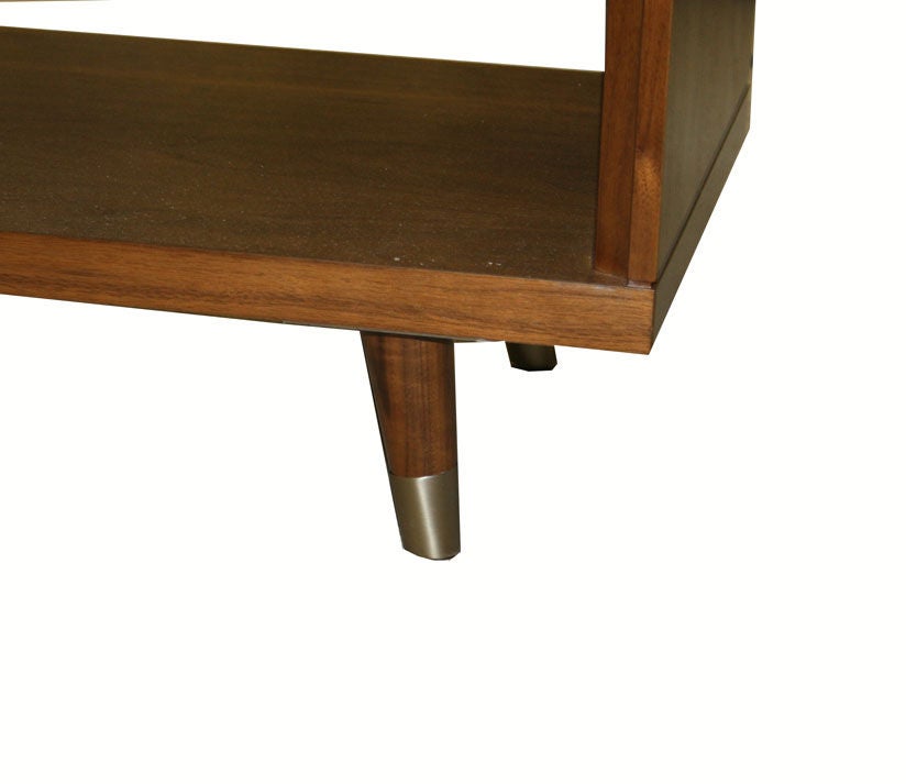 Walnut and parchment one-drawer nightstands on solid tapered walnut legs detailed with brass sabots. Custom embossed design on natural parchment drawer.
Sabots shown not included in list price.

Custom orders have a lead time of 10-12 weeks FOB NYC.