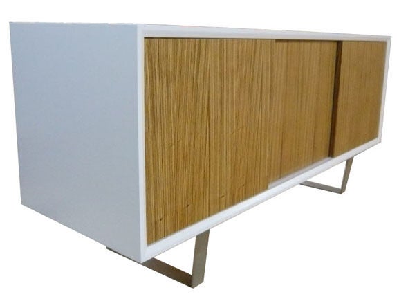 Mn originals lacquered media console with zebra wood veneer sliding doors on nickel flat bar base. Satin lacquered body contrasts with exotic zebra wood doors. Thin-profile nickel-plated base supports the cabinet. 

Custom orders have a lead time