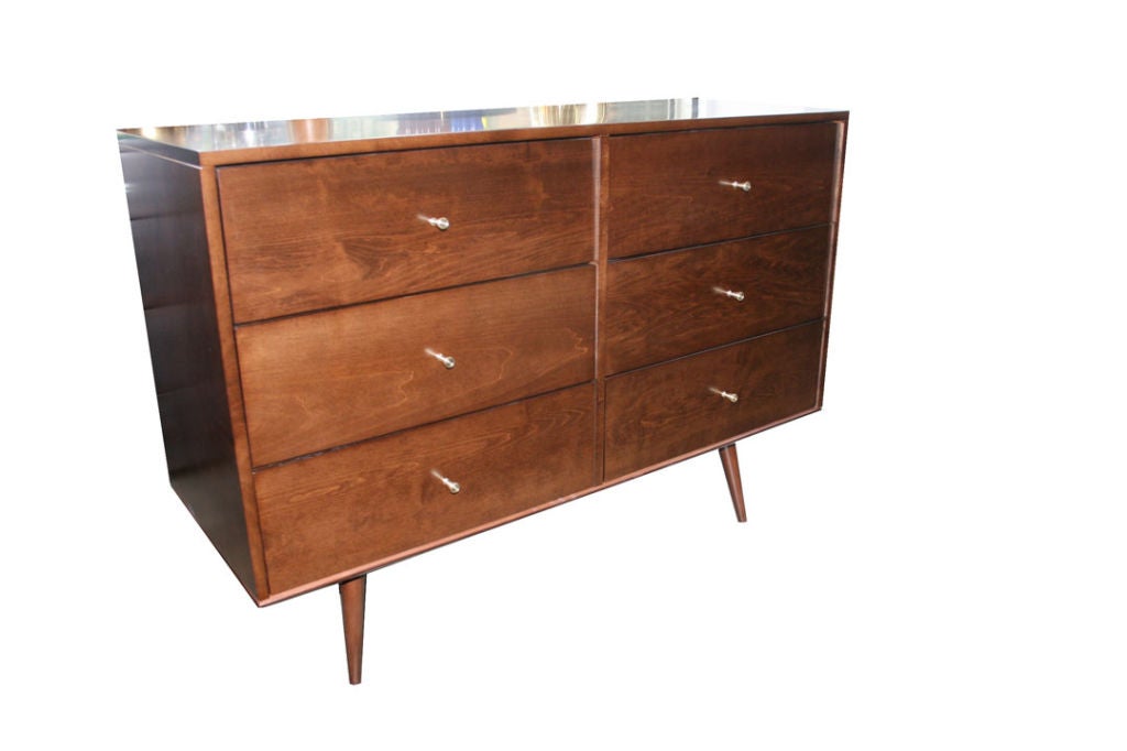 Paul McCobb 6 drawer Planner group dresser Ca. 1950s in fully restored condition.Solid maple construction throughout the original McCobb dresser has been restored in a rich satin walnut finish and outfitted with original solid brass conical drawer
