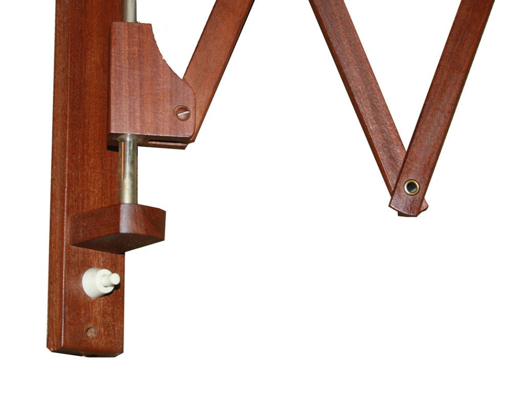 1950's danish teak wall mounted scissor arm lamp.All Original this solid teak lamp lamp with adjustable linen shade lamp fixture easily mounts to any wall and simply plugs in to a standard wall outlet.