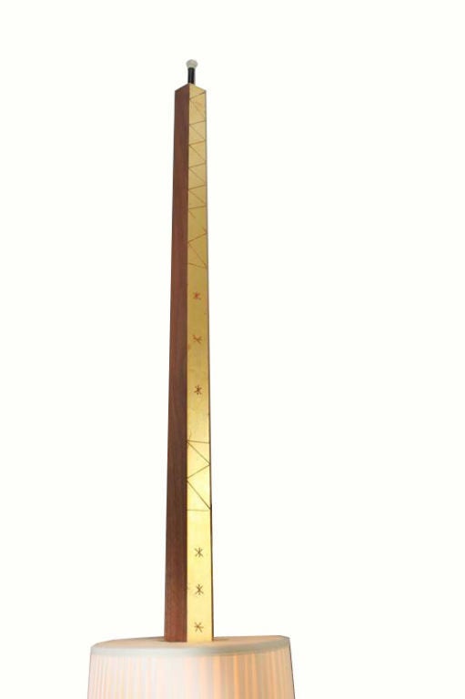 Original adjustable floor lamp by Phillip Lloyd Powell. One of a limited edition of five. Walnut with 22kt gold finished with geometric patterning carved into the surface. The shade is pleated silk and 12