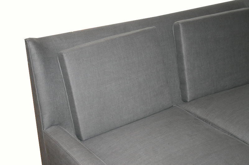 Sculpted frame loose cushion settee on solid turned legs with down upholstery.

COM requirements: 12 yards. 
5% up-charge for contrasting fabrics and or welting.
COL Requirements: 240 sq. feet.
5% percentage up-charge for all COL or exotic