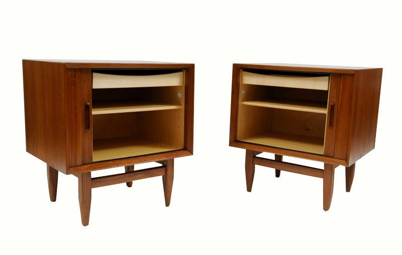 1960's Danish modern tamboor door teak nightstands by Falster. Incredible tamboor door mechanism allow the front to wrap around to the side without needing any space to allow for this to stay open.Interior has one adjustable shelf and one single