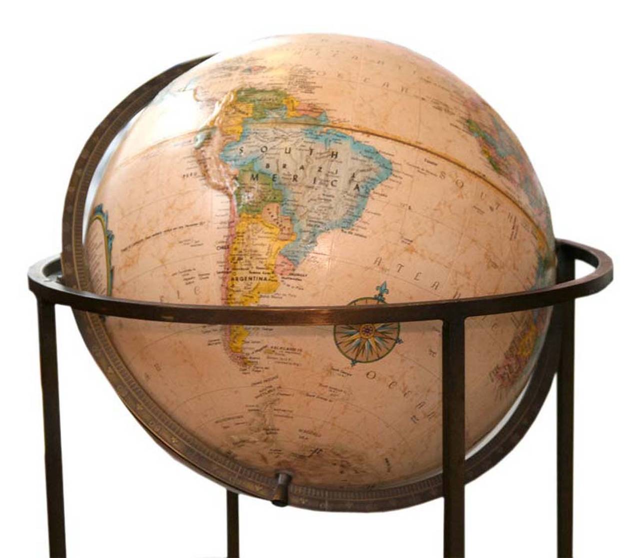 Paul McCobb style brass standing floor terrestrial globe, circa 1960. Gorgeous rotating globe with full 360 axis pivoting and spinning motion. Globe has raised textured exterior.